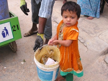"Hmm... I am just doing my job!" Is that what this little two-year-old Noor Hazira saying? 