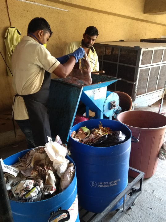Raheja Classique staff shreds the wet waste